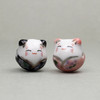 Ceramic cat beads for playful DIY projects.