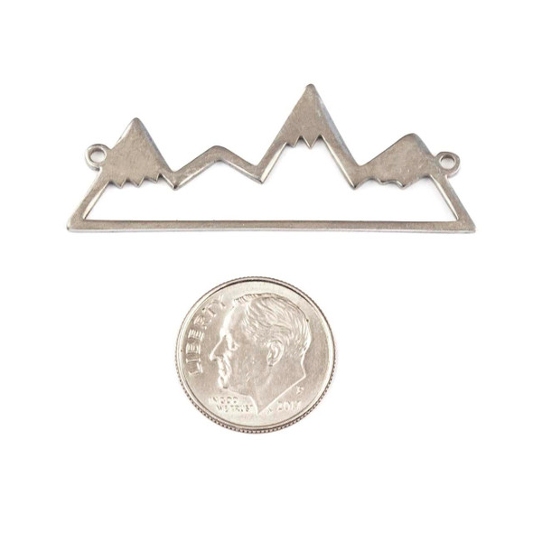 Cherry Tree Beads Natural Silver Stainless Steel 17x45mm Mountain Component with 2 Loops beside a coin