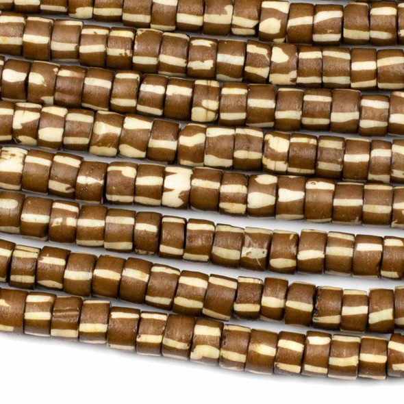 Cherry Tree Beads 5x8mm bone heishi beads in brown with carved white vertical line details, 8-inch strand.