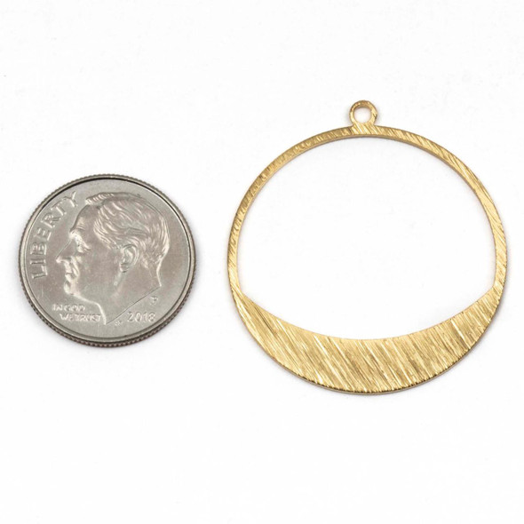 Six lightly textured 28x30.5mm brass hoop components in raw and coated finishes, shown on a neutral background.