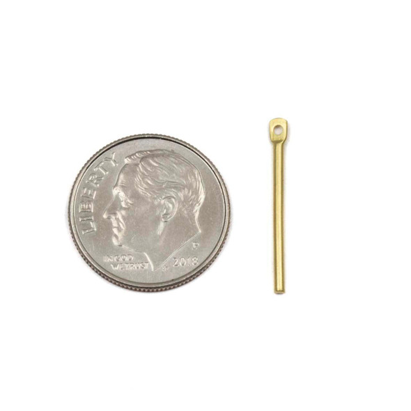 One slender 1x20mm round bar drop component available  in raw and coated brass, shown on a neutral background to highlight their sleek metallic finish.