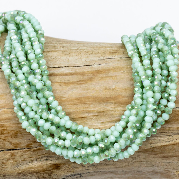 Cherry Tree Beads Crystal Beads - approx. 2x2.5mm Opaque Light Seafoam Green Faceted Rondelles with a Green Rainbow finish, 15 inch strand 