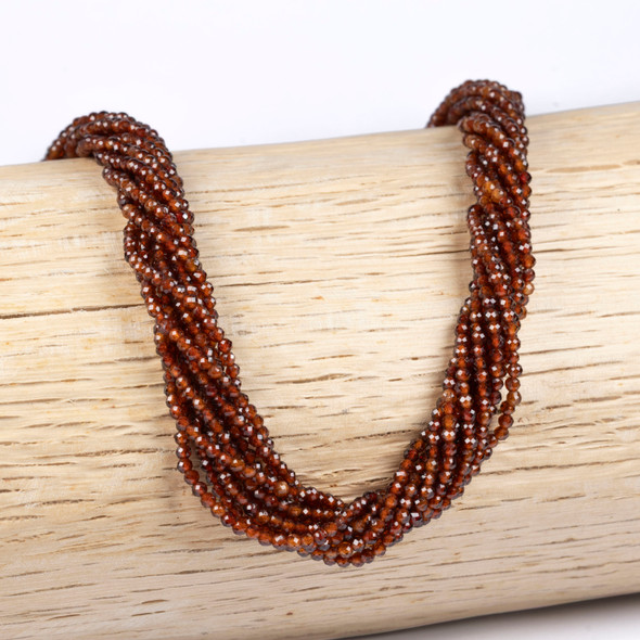 Cherry Tree Beads BOGO Peach Garnet 2mm Faceted Round Beads - 15 inch strand draped over branch