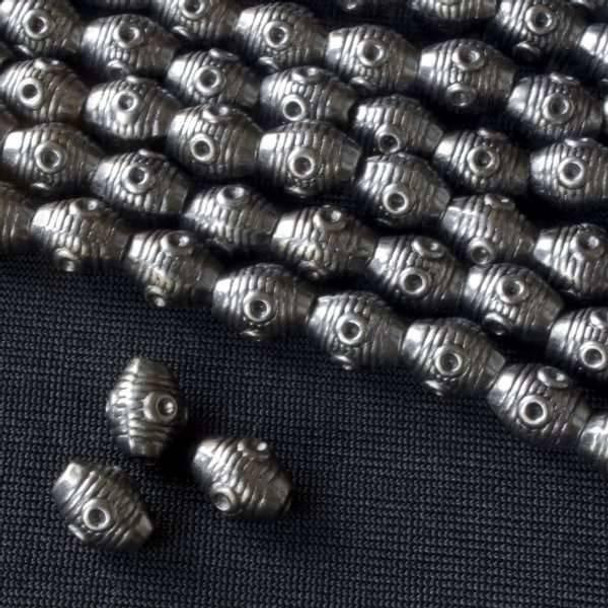 Cherry Tree Beads Gun Metal Colored "Pewter" (zinc-based alloy) 6x8mm Rice Beads with Circles and Hoizonal Line - approx. 8 inch strand - Basea0049gm 