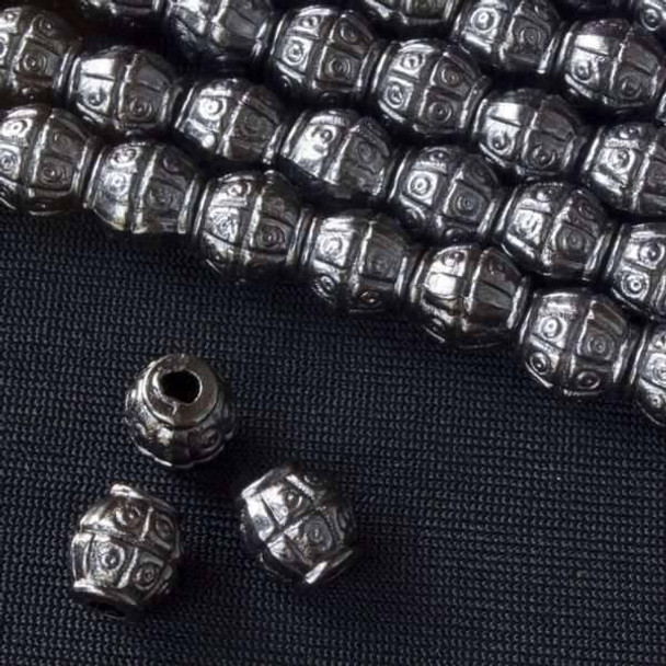 Cherry Tree Beads Gun Metal Colored "Pewter" (zinc-based alloy) 7mm Tapered Barrel Beads with Grid & Circle Pattern - approx. 8 inch strand - basea0285gm 