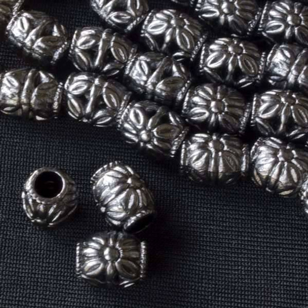 Gun Metal Colored Pewter 8x10mm Barrel Beads with Large Flowers on each side - approx. 8 inch strand - basea0855gm