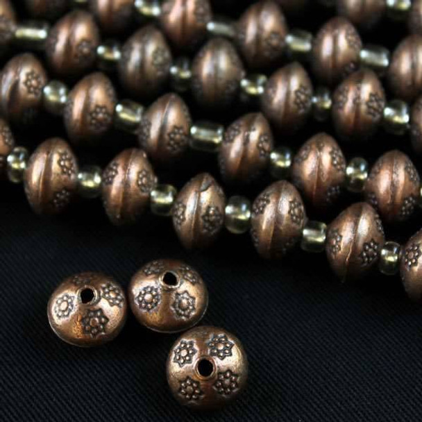 Vintage Copper Colored Pewter 7x10mm Thai Style Beads Smooth with Small Detailed Stars - approx. 8 inch strand - basea5009vc