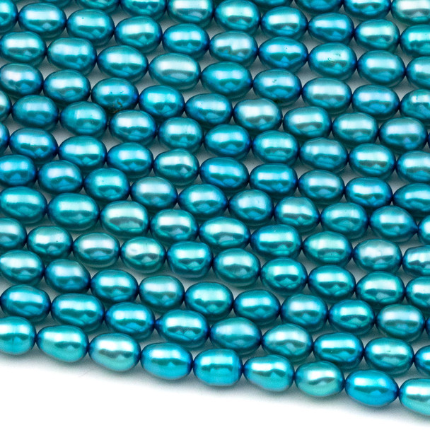 Fresh Water Pearl 4-5x5-6mm Bright Blue Rice Beads - 16 inch strand