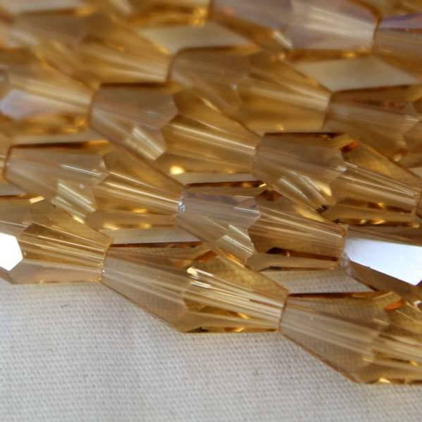 Glass Crystal Faceted 6x12mm Champagne Long Bicone - approx. 8 inch strand