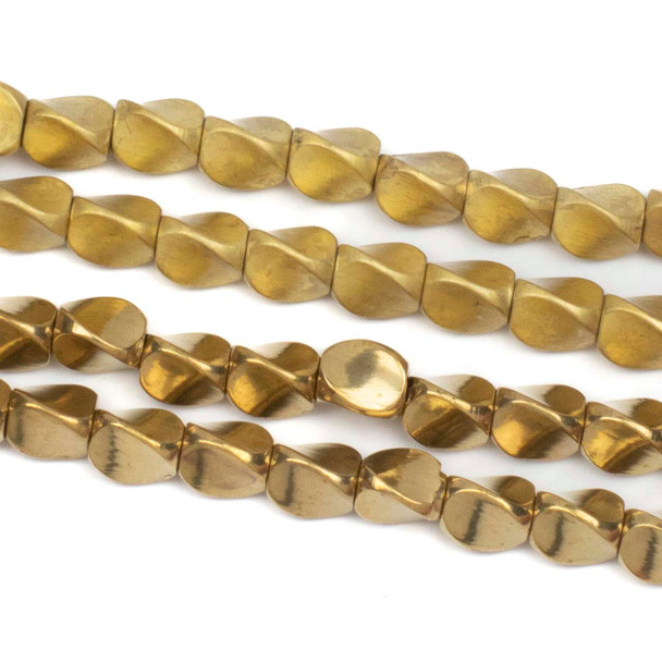 Close-up view of twisted 3-sided brass spacer beads in 4.5x5mm size, strung on an 8-inch strand, showing raw and coated brass finish options with 1.5mm holes.