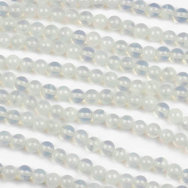 Close-up view of Synthetic Opalite 4-4.5mm round man-made gemstone beads in Set A, featuring an 8-inch strand with a luminous and smooth finish.