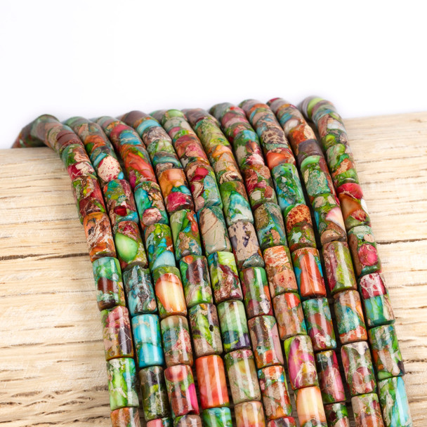 Cherry Tree Beads Dyed Fiesta Rainbow Impression Jasper 4x8mm Tube Beads - color #06 on a 15-inch strand featuring colorful tube-shaped gemstone-style beads for jewelry making.