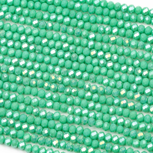 Crystal approximately 2x2mm opaque paradise green faceted rondelle beads with an AB finish on a 15-inch strand, featuring shimmering crystal beads perfect for vibrant jewelry designs.