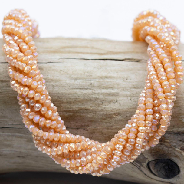 Cherry Tree Beads Crystal Beads - approx. 2x2.5mm Opaque Peach Fuzz Faceted Rondelles with AB finish, 15 inch strand  Cherry Tree Beads Crystal Beads - approx. 2x2.5mm Opaque Peach Fuzz Faceted Rondelles with AB finish, 15 inch strand