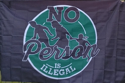 No Person is Illegal black flag