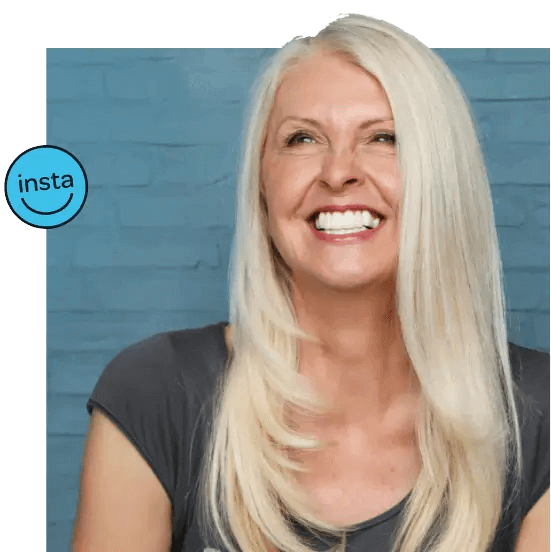 Woman smiling while wearing clip in veneers 