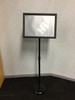 Adjustable metal poster stand with 360° rotatable snap frame