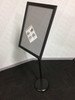 Adjustable metal poster stand with 360° rotatable snap frame