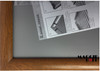 Close-up of the wood-grain finish on a 25mm snap frame profile