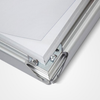 Corner of a silver 32mm snap frame opened to show the snap rail and hidden screws