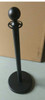 black rope stanchion in use guiding a queue