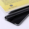 A3 acrylic sign holder shown landscape on a counter as a double sided menu stand