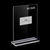 A5 double-sided acrylic sign holder in portrait orientation on a desk