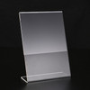 A5 portrait slant back acrylic sign stand used as a menu holder on a counter