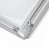 Corner of a silver 32mm snap frame opened to show the snap rail and hidden screws