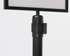 Black A4 landscape sign holder attached to a retractable belt queue bollard