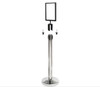 Silver sign holder fitted to the top of a queue barrier post