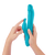 Booster Rabbit XL Rechargeable Rotating Vibrator - Turquoise in hand with hand touching the ears of the clitoral rabbit