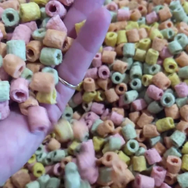 A handful of colourful mini dog treats made by Huds and Toke