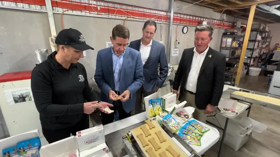 Emma Gibbons showing Huds and Toke treats on the production floor of the Coolum Beach facility