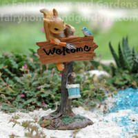 Miniature Squirrel Painting a "Welcome" Sign