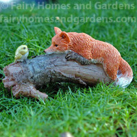 Playful Fox with Bird Figurine