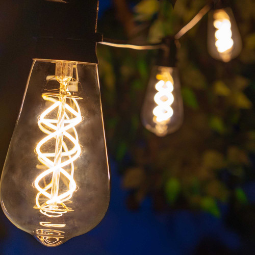 WGC-84129 - 15' Warm White LED FlexFilament Commercial Patio String Light Set with 10 5W ST64 Edison Bulbs, Black Wire, 18" Spacing - Wintergreen Corporation