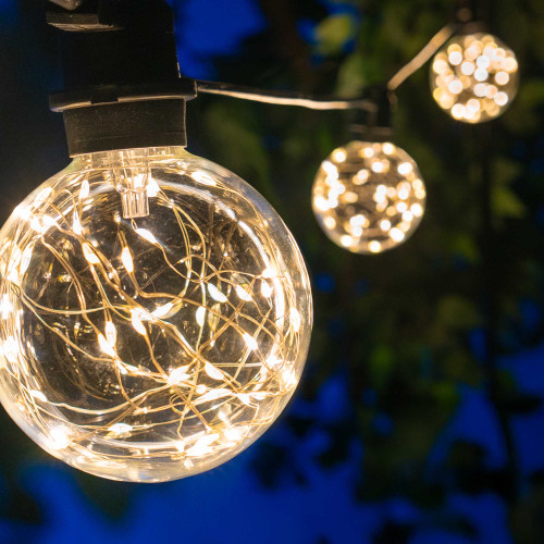 WGC-84134 - 45' Warm White LED Commercial Patio String Light Set with 15 G95 Fairy Light Bulbs, Black Wire, 36" Spacing - Wintergreen Corporation