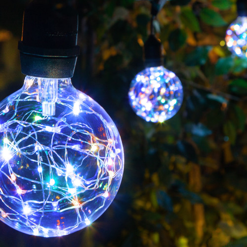 WGC-84764 - 15' RGB LED Commercial Color Change Patio String Light Set with 10 G95 Fairy Light Bulbs, Black Wire, 18" Spacing, with Drops - Wintergreen Corporation