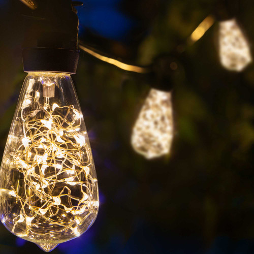 WGC-84769 - 45' Warm White LED Commercial Patio String Light Set with 15 ST64 Fairy Light Bulbs, Black Wire, 36" Spacing - Wintergreen Corporation
