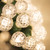 WGC-20331 - G12 Warm White LED String Lights, 70 Lights, 24', Green Wire, 4" Spacing - Wintergreen Corporation