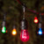 Wintergreen Corporation 71912 54' Commercial Multicolor Patio String Light Set with 24 S14 Bulbs on Black Wire, with Drops