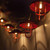 WGC-76932 - Red Lantern String, 5mm Warm White LED, 10 Lights, Clear Wire, 8" Spacing - Wintergreen Corporation