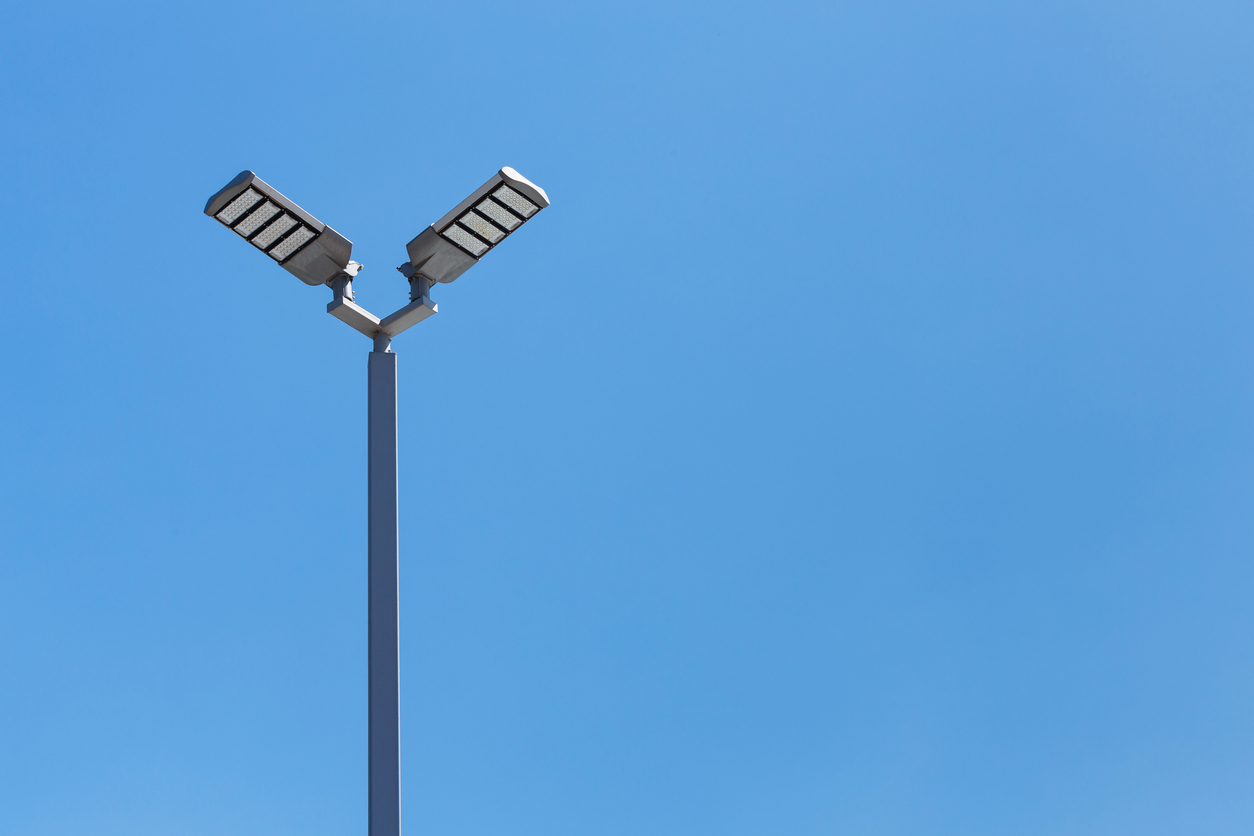 two-parking-lot-area-lights-mounted-on-light-poles.jpg