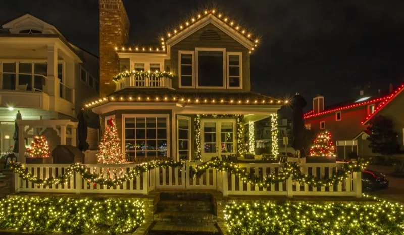 Commercial building exterior outlined in warm white C9 string lights