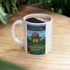 National Park Junior Ranger mug with pixel-style explorer badge, blocky landscape, and adventure game-inspired artwork