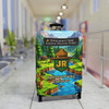 Junior Ranger luggage cover with pixel-style national park design on suitcase