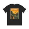 Louisiana Bayou alligator T-shirt featuring vintage-inspired MOMENT No. 002 artwork with an explorer on a dock and an alligator in the swamp.
