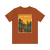 Autumn Louisiana Bayou alligator T-shirt featuring vintage-inspired MOMENT No. 002 artwork with an explorer on a dock and an alligator in the swamp.