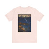 Dry Tortugas National Park Florida shark T-shirt featuring vintage-inspired MOMENT No. 003 artwork with a nighttime fisherman, shark, Fort Jefferson and starry sky.